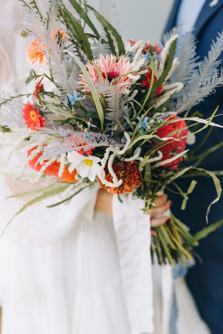 wildflower bridal bouquet with feathers